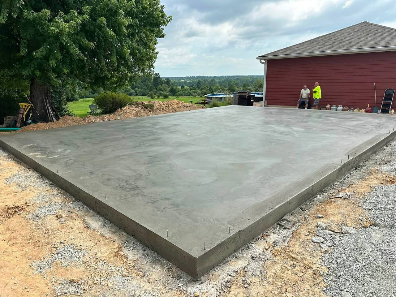 Finished building slab with anchor bolts set around the edge